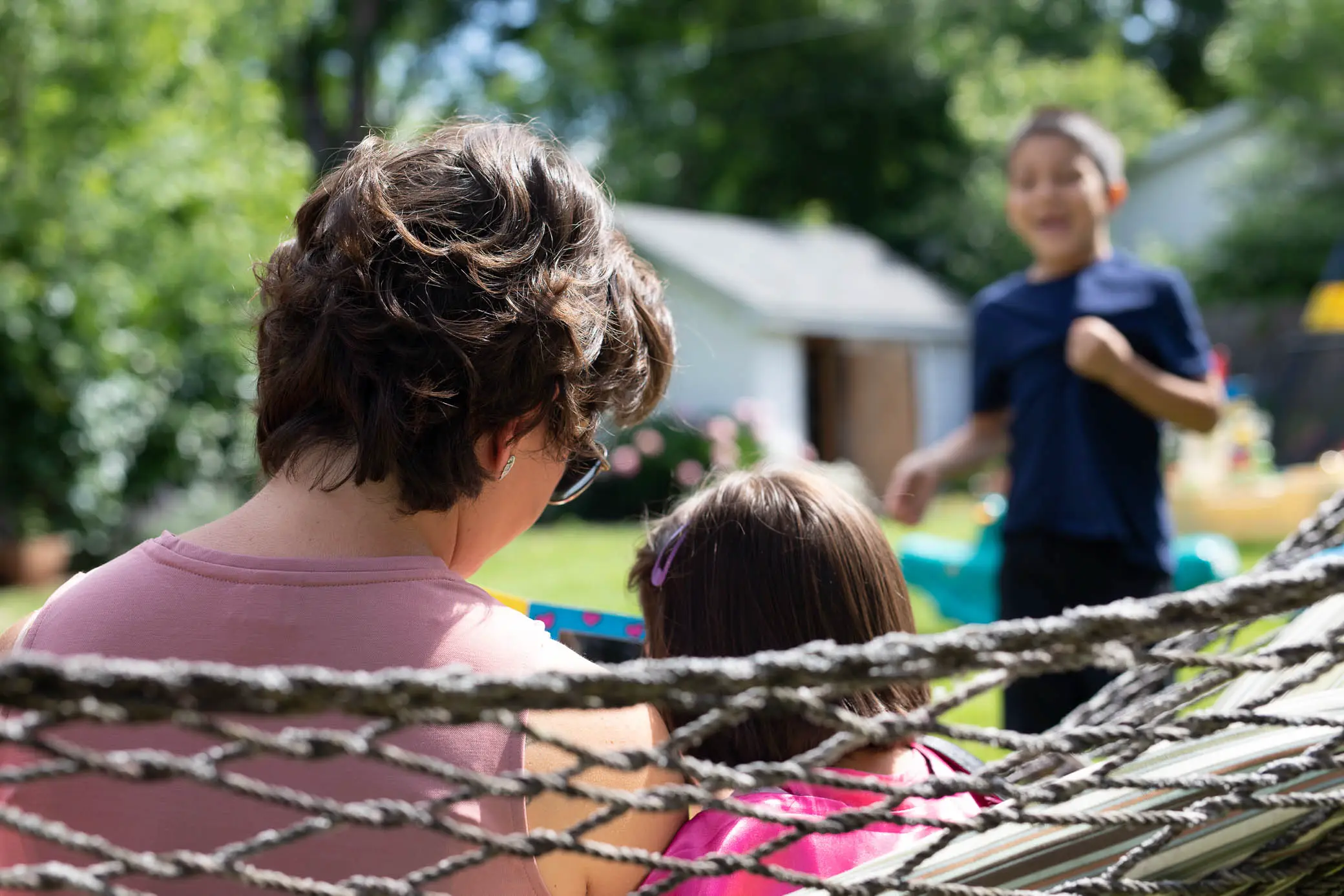 photo of a mom and girl on a hammock